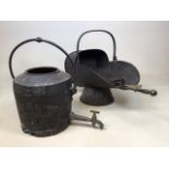 An iron coal scuttle and a cast iron pot with tap A/F also with toasting forks and other items