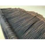 A roll of black and taupe abstract printed silk. In excess of 10m? W:145cm