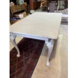 A painted extending dining table. W:152cm x D:92cm x H:70cm