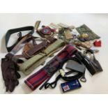 a quantity of military accessories including badges of rank, belts, trinkets and other items