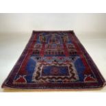 A vintage Afghan Baluch rug W:87cm x H:144cm