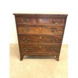 A small Georgian style chest of drawers with four long drawers with brass handles. W:68cm x D:47.5cm