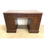 An early 20th century three piece pedestal desk stamped Bulstrode Cambridge, with nine drawers. W: