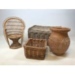 A small wicker peacock chair suitable for plants or doll also with a wicker hamper, basket and