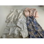 A vintage bed jacket, a vintage viscose printed pinny and a quantity of Early 20th century baby