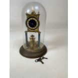 A brass anniversary clock with blue enamel face, glass dome, two keys. W:19cm x H:30cm
