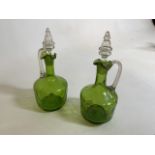 A pair of Victorian green glass claret jugs H:26cm