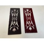 A pair of embossed red glass panels W:12cm x H:33cm