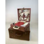 A vintage Brexton picnic hamper for two also with a vintage suitcase