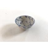 Small, 19th century Chinese ceramic bowl, handpainted in blue and white with decor in the manner