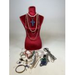 Costume jewellery with jewellery mannequin - mainly necklaces including coral and a beaded collar