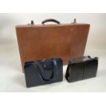 A vintage leather monogrammed dressing case made by A Barrett and son, Piccadilly. Monogram of crown