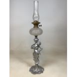 A silvered metal figural oil lamp of a lady in art nouveau style W:17cm x H:86cm includes shade