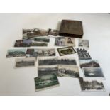 A post card album of assorted cards including world travel and others together with Pictures of