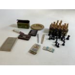 Assorted vintage chess pieces with other collectible items including a Parker pen, penknife, railway