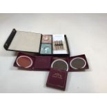 A vintage cased Bridge set complete with pencils and score pad also with a boxed set of