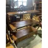 An early 20th century mahogany three tier Buffett with two drawers to the base, with carved supports