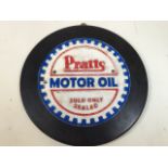 Pratts cast iron motor oil advertising plaque on circular plinth.