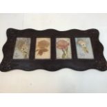 Victorian cards in carved oak frame depicting flowers W:49cm x H:23cm