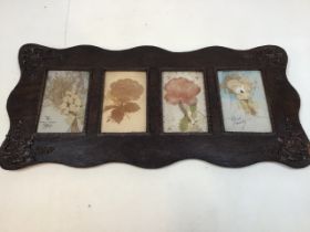 Victorian cards in carved oak frame depicting flowers W:49cm x H:23cm