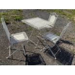 A Square metal and wood folding garden table and three chairs.