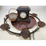 A wooden Mantel clock with a copper tray, a trug of glass lustres and a cast iron ceiling candle
