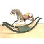 A hand painted 20th century rocking horse on wooden rocker. A/F Seat height H:78cm