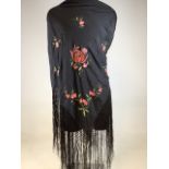 A silk embroidered piano shawl circa 1920 with deep fringing. Box inscribed with history of the