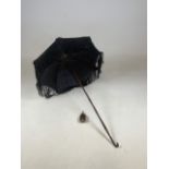 A vintage parasol with silk fringing and another handle. A/F H:69cm