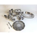 Assortment of silver plate items to include a tureen, two serving trays and a tea-coffee set. Handle