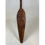 A Large wooden carved tribal paddle. H:158cm