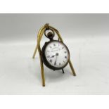 Vintage Swiss movement pocket watch, presented upon a travelling display stand. Watch case