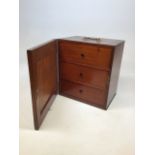 A Victorian table top sewing cabinet with three draws and carry handle. Key hole to side - no key.