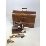 A cased Singer sewing machine - no key - also with an Essex miniature sewing machine