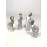 Four Lladro figurines includes girl stretching and girl kissing with other ceramic items