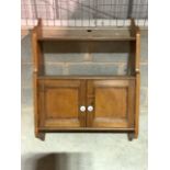 A small antique pine wall hanging cupboard with ceramic handles. W:66cm x D:24cm x H:87cm