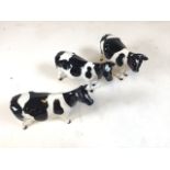 3 ceramic Beswick Fresian cow figures, each displays the makers mark to underside. Good