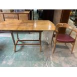 A Remploy extendable mid century table also with a Scandinavian style armchair.