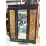 An Asthetic movement continental mid to late Victorian hand painted wardrobe. With pin hinge
