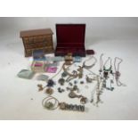 A quantity of costume jewellery with a wooden jewellery chest and a jewellery box