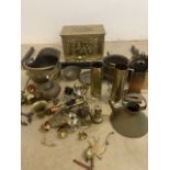 A large collection of brass and copper fire associated and other items. To include coal scuttles a