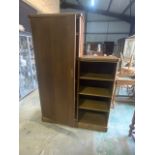 A 20th century oak wall cupboard and shelves. W:132cm x D:34.5cm x H:183cm