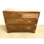 A Victorian teak military chest with brass bound corners and campaign handles. With two keys. W: