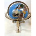 A gem stone globe on gilt stand. H:50cm