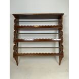 A set of early 20th century mahogany ships shelves with metal safety bars. W:82cm x D:20cm x H:86cm