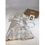 A vintage Communion dress from 1912 with headdress. Also with photograph of Lucile May Agnes wearing