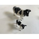 Beswick Champion Claybury Leegwater Friesian cow with calf - marked to underbelly. Both with heart