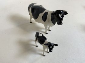 Beswick Champion Claybury Leegwater Friesian cow with calf - marked to underbelly. Both with heart