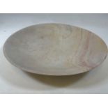 A large soapstone dish. W:46cm x D:46cm x