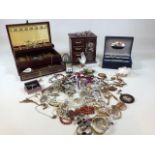 A quantity of costume jewellery and jewellery boxes includes, necklaces, brooches, rings, earrings